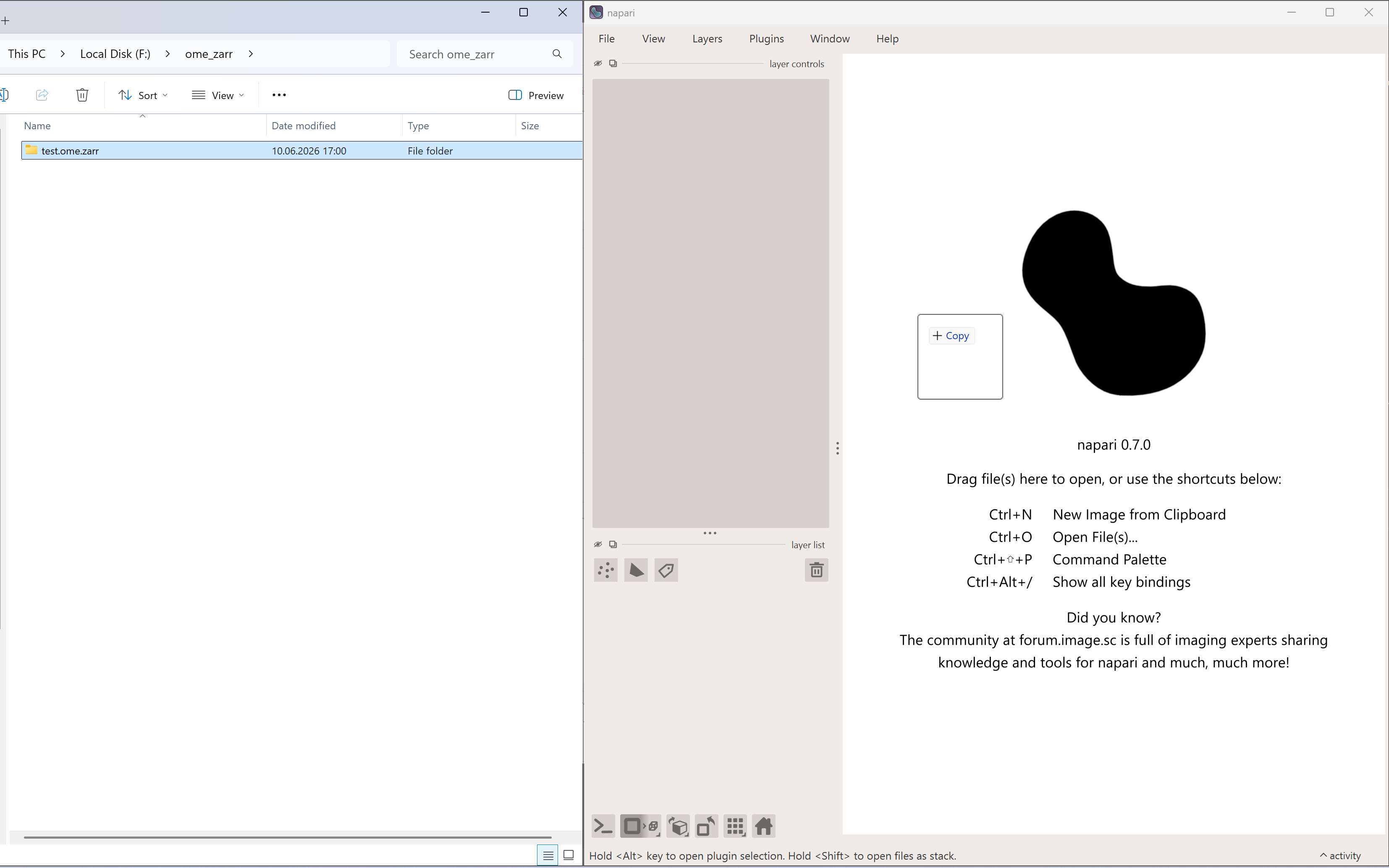 OME-Zarr dataset being dragged into the napari window.